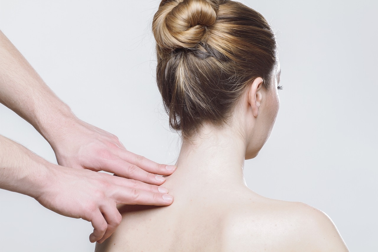 therapist pressure pointing sore shoulder/neck