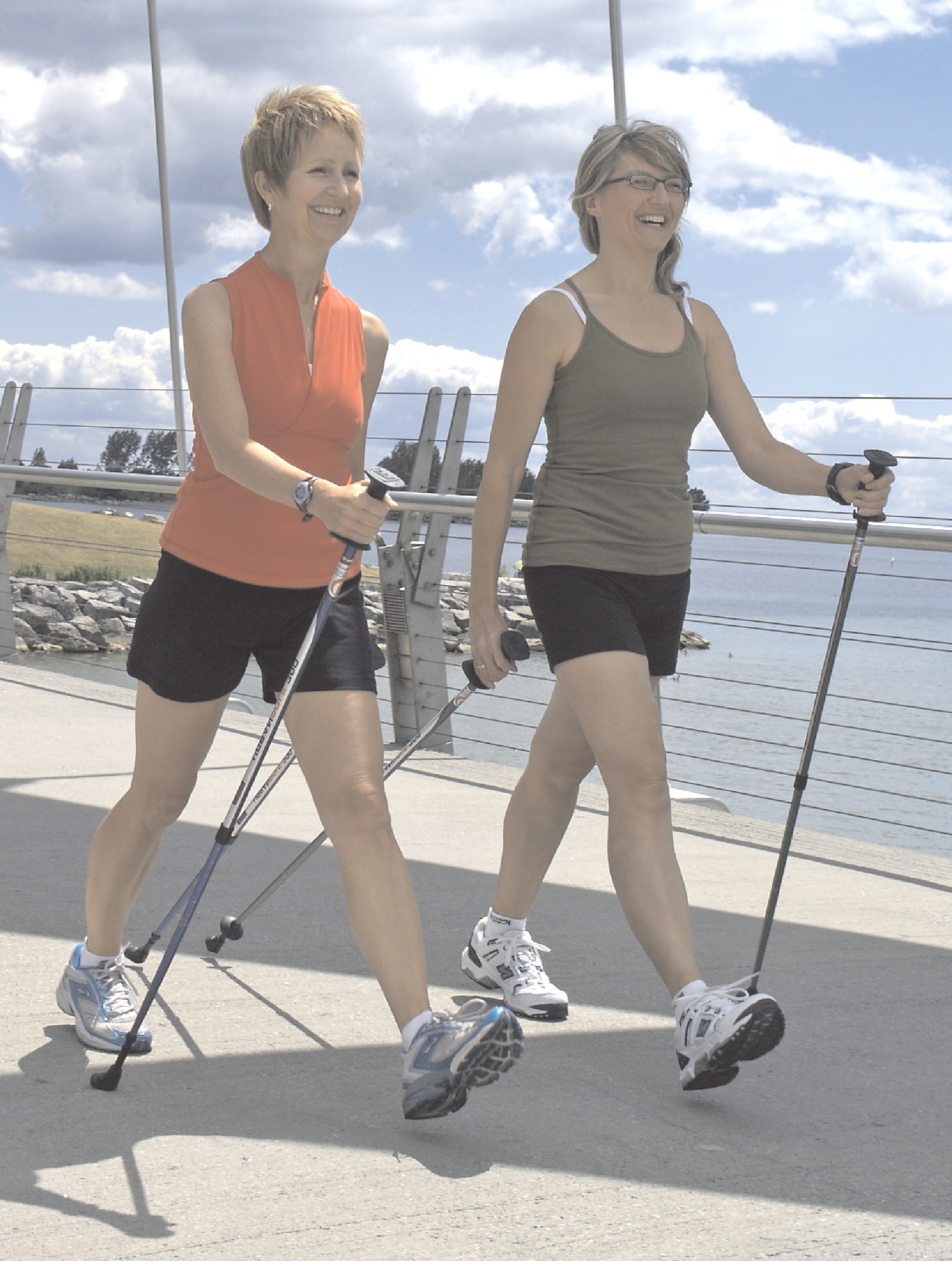 2 women walking with nordic poles