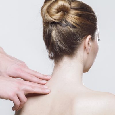 therapist pressure pointing sore shoulder/neck